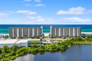 A hotel with a pool, a beach view, and a parking lot. - Gulf-Front Seachase Escape w/ Beach Service (Panama City Beach)