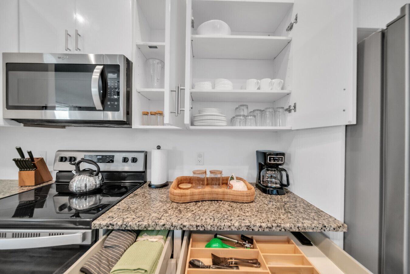 Coffee/tea maker, fridge, microwave, oven
