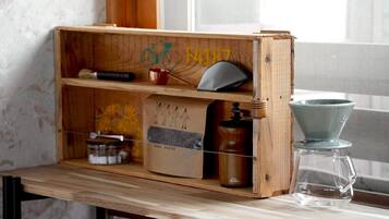 A wooden shelf with a bicycle symbol, a number 4187, and a coffee maker.