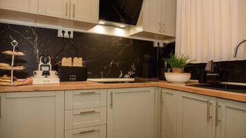 Fridge, microwave, stovetop, coffee/tea maker