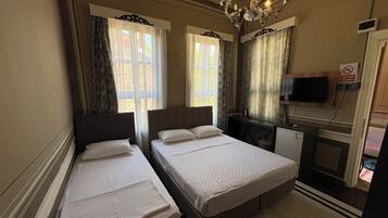 Standard Triple Room | Premium bedding, in-room safe, laptop workspace, blackout drapes