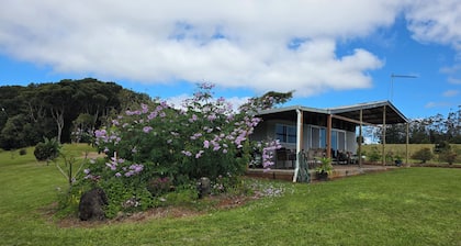 A Rustic 3 brm Farm House located on 25 acres in Ravenshoe with rock pools.