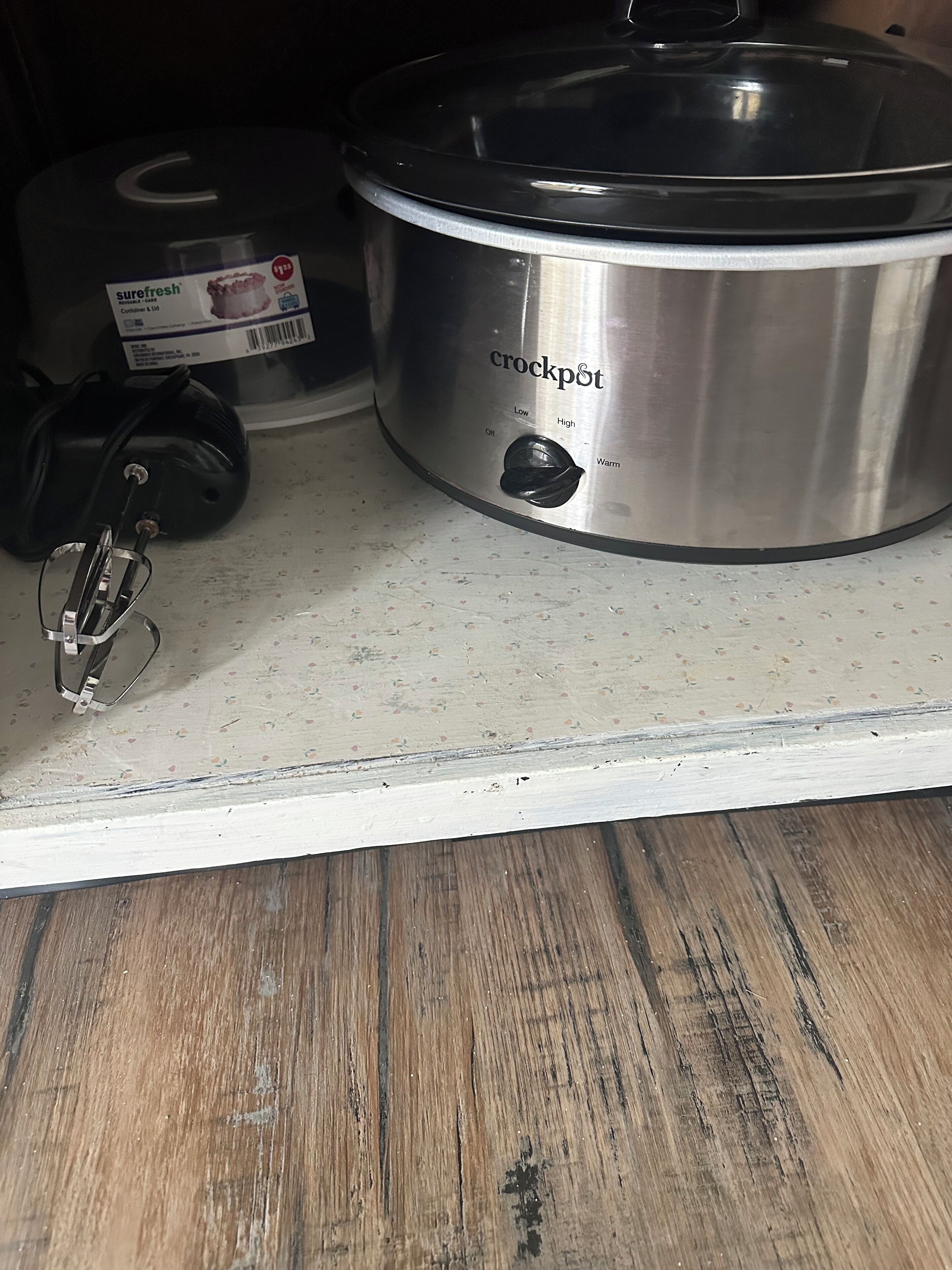 A stainless steel crockpot on a kitchen counter.