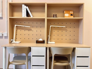 A workspace with two desks, each with a pegboard wall, a desk lamp, and a tissue box. - Runway 1331 - Campus Hostel (Kowloon)