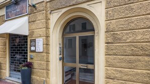 A building facade with a sign reading 'Marcella Maffei Beauty Home.' - [Sea 3m] Trains 8m • A/C • FreeWiFi (Albisola Superiore)