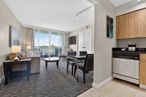 A modern hotel room with a living area, dining space, and kitchen. - Gallery One  Spa  Heated Pool   Boat Taxi (Fort Lauderdale)