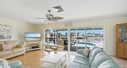 What a VIEW!!! Direct access waterway with dock. Key lot on cul de sac street.