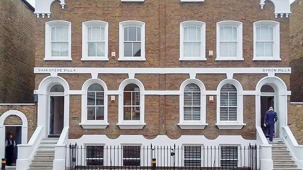 A two-story building with arched windows and a central entrance. - Hybrid Resi Battersea (London)