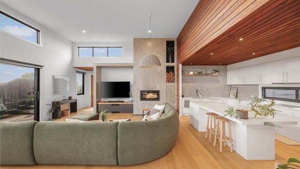 A modern interior with a living area, kitchen, and dining space, featuring a large TV, fireplace, and wooden ceiling. - Surfers Rest in Surf Beach (Surf Beach)