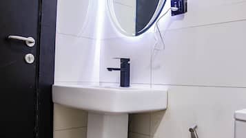 Economy Apartment, Balcony, City View | Bathroom | Hair dryer, towels, soap, shampoo