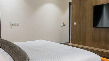 Economy Apartment, Balcony, City View | In-room safe, desk, laptop workspace, blackout drapes