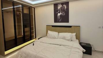 Economy Apartment, Balcony, City View | In-room safe, desk, laptop workspace, blackout drapes