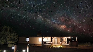 A building with a covered porch and a starry night sky. - Stargazing Oasis | A/C | 35 Min to Grand Canyon (Williams)