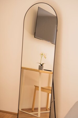Design Studio | Desk, laptop workspace, blackout drapes, iron/ironing board