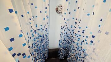 Shower, towels, soap, toilet paper