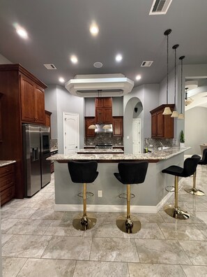 Fridge, microwave, oven, stovetop - One of a Kind custom 4-bedroom home with gorgeous ceilings design in Humble (Humble)