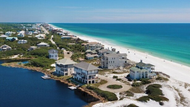 A coastal residential area with beachfront properties, a marina, and a clear view of the ocean. - Private 30A Beach Retreat - Coastal Backyard Oasis (Santa Rosa Beach)