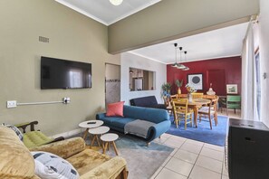 Apartment, 3 Bedrooms, Patio | Living room | Books - The Cozy Three Bedroom Home With Back up Water (Johannesburg)