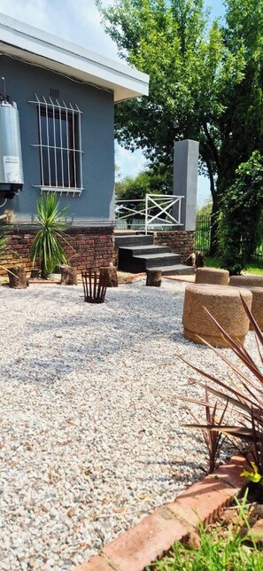 Apartment, 3 Bedrooms, Patio | Property grounds - The Cozy Three Bedroom Home With Back up Water (Johannesburg)