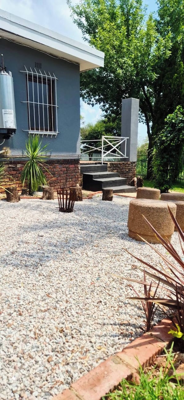 Apartment, 3 Bedrooms, Patio | Property grounds - The Cozy Three Bedroom Home With Back up Water (Johannesburg)