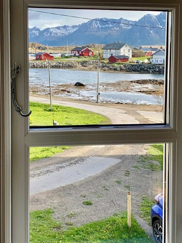 Red cottage by the sea in Laukvika