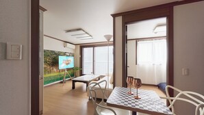 A room with a checkered table, white chairs, a painting, and a window with curtains.