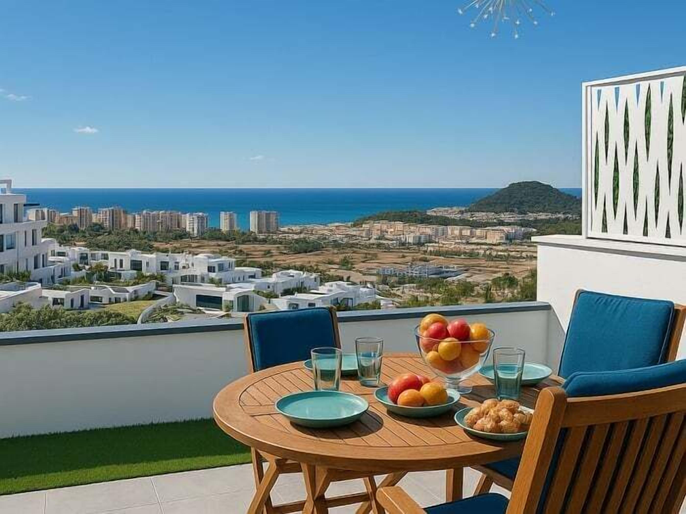 A balcony with a table set for two, a bowl of fruit, and glasses.