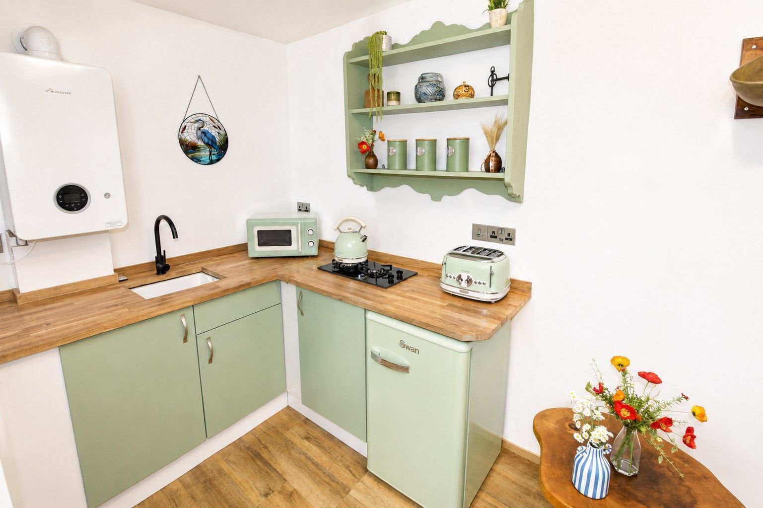 Fridge, microwave, coffee/tea maker, cookware/dishes/utensils