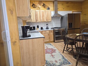 Private kitchen - Peaceful 2-bedroom cabin with AC in charming Irons, hot tub, sauna, covered deck (Irons)