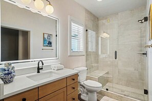 Shower, hair dryer, towels, shampoo