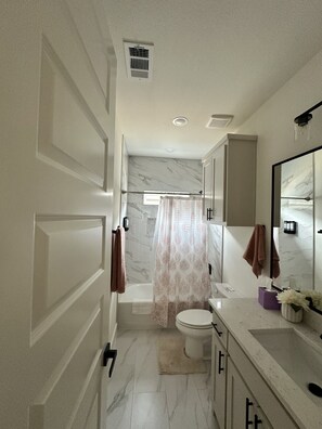 Hair dryer, towels, soap, toilet paper