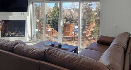 Modern 2 bedroom slopeside retreat with private hot tub.
