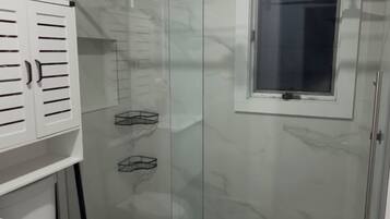 Shower, towels, soap, toilet paper