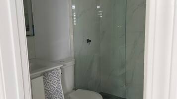Shower, towels, soap, toilet paper