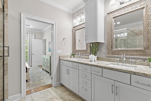 A bathroom with a large mirror, a sink, and a shower. - Driftwood Townhomes #1- Beachwaves (Miramar Beach)
