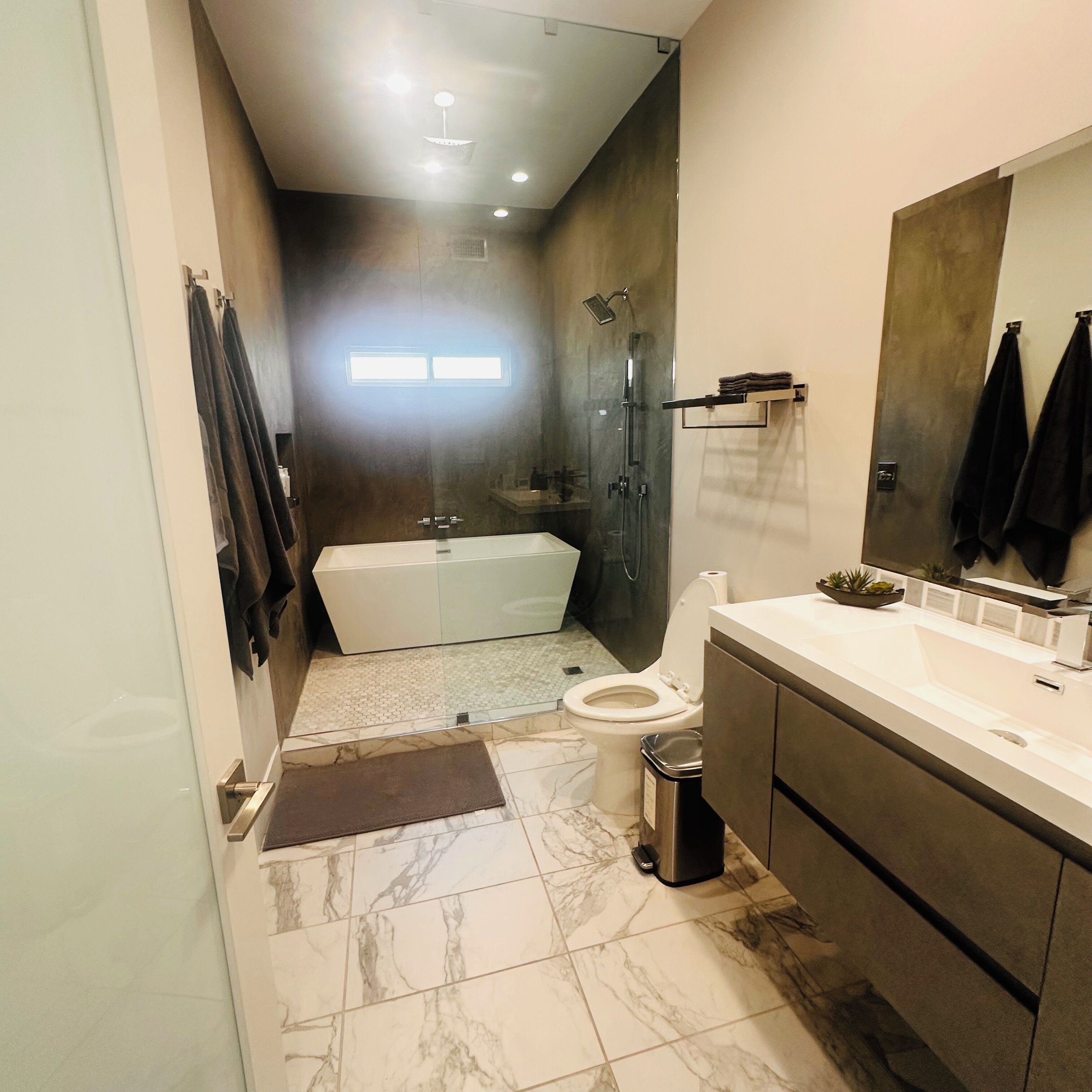 Shower, towels, soap, toilet paper