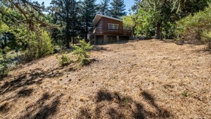 A cabin surrounded by dense forest, with a stone foundation and a wooden upper level. - Chalet Gré, between greenery and Cevennes mountains (LE POMPIDOU)