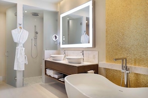 A modern bathroom with a freestanding bathtub, a large mirror, and a walk-in shower. - Studio at 5 Diamond Resort - Villa la Valencia in Cabo San Lucas (cabo san lucas)