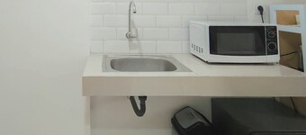 Neat And Warm Studio Room At Apartment Bandaraya - Tallasa City Makassar