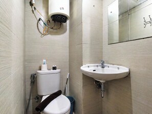 A bathroom with a toilet, bidet, sink, and a mirror. - Compact 2 Pax Studio Room At Gateway Pasteur Apartment (Cimahi)
