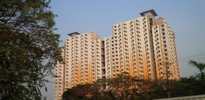 A high-rise building with multiple floors, balconies, and a flat roof. - Comfortable And Decent 2Br At Apartment Kemang View (Bekasi)