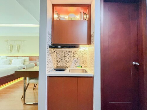 Classic Wooden Touch Studio Room At Apartment Mataram City