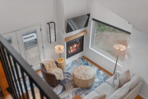 TV, fireplace, books