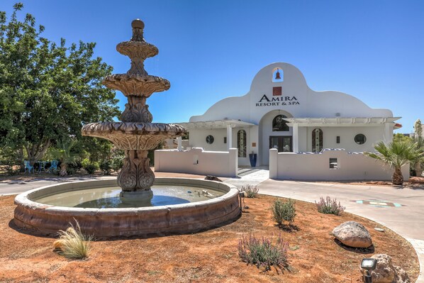 A fountain in front of a building labeled "Amira Resort & Spa". - Amira Resort #17 | Studio | Near Pools and Pickleball! (Saint George)