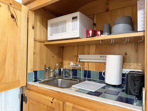 A compact kitchen with a microwave, sink, and a toaster. - Amira Resort #17 | Studio | Near Pool & Pickleball (Saint George)