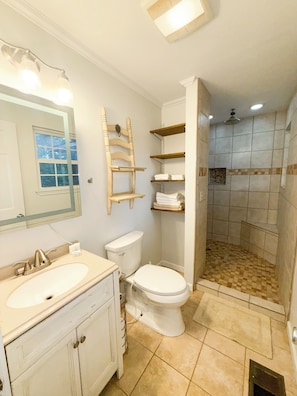Shower, towels, soap, toilet paper