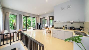 Family Villa, 2 Bedrooms, Kitchen, Garden View | Living area | 50-inch Smart TV with digital channels