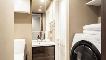 Base Studio Apartment | Bathroom | Separate tub and shower, hair dryer, slippers, towels