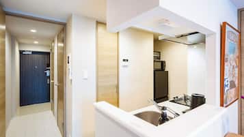 Premier One-Bedroom Apartment | Private kitchen | Full-size fridge, microwave, stovetop, electric kettle