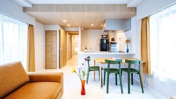 Premier Family One-Bedroom Apartment | Living area | 50-inch Smart TV with satellite channels